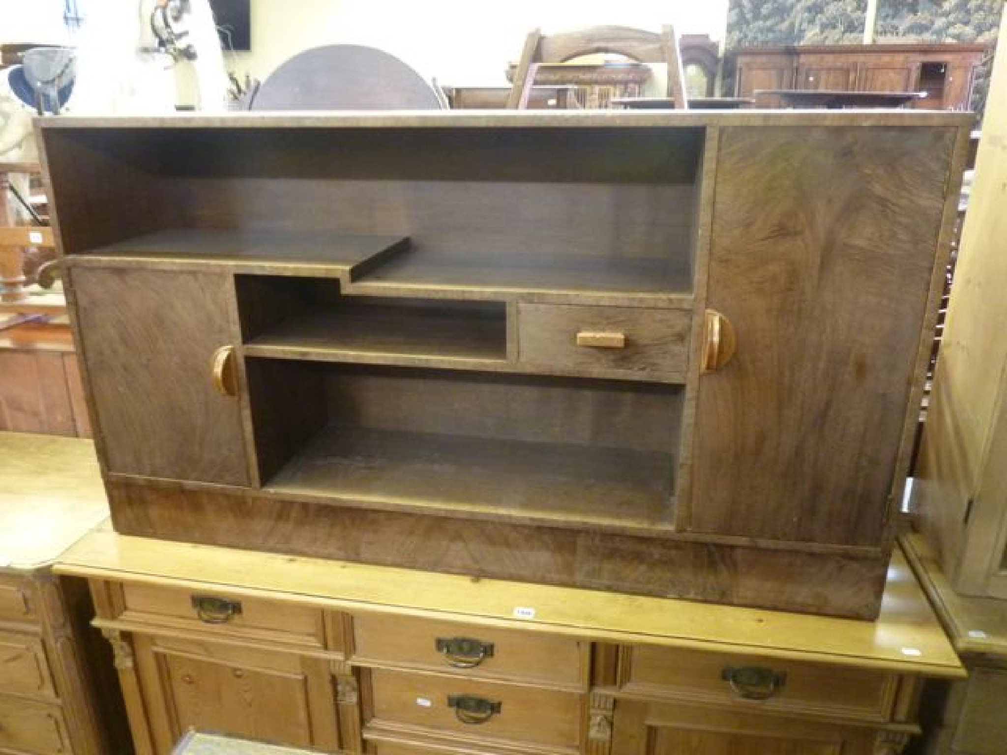 Appraisal: An Art Deco walnut side cupboard fitted with a stepped