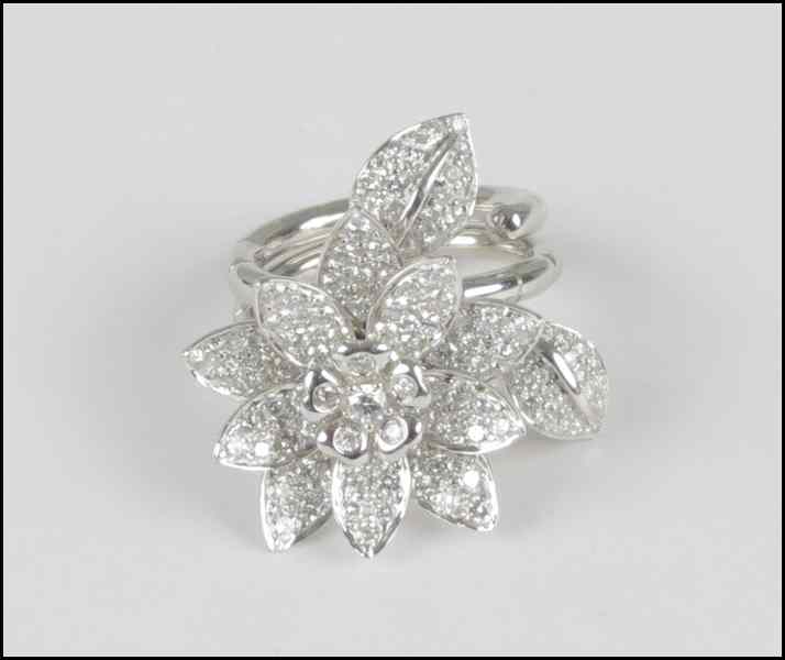 Appraisal: WHITE GOLD AND PAVE DIAMOND FLOWER FORM RING Van Cleef