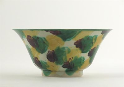 Appraisal: A Chinese brinjal bowl decorated with splashes of yellow green