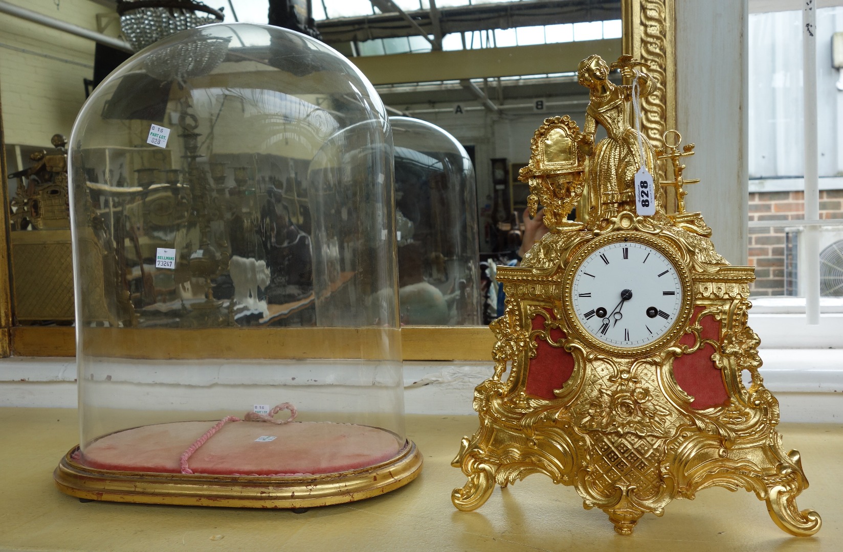 Appraisal: A French gilt metal mantel clock th century with figural