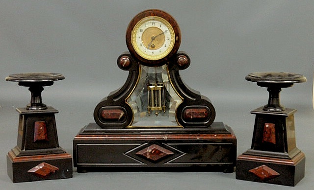 Appraisal: French black and red marble mantle clock with a beveled