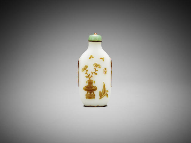 Appraisal: A Chinese incised olive-brown glass overlay 'bogu' snuff bottle Yang