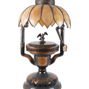 Appraisal: A Fairy Phonograph Patinated Metal Lamp with a Slag Glass