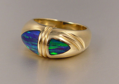 Appraisal: K BLACK OPAL RING K yellow gold ring contains bullet