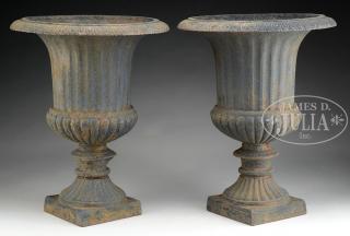 Appraisal: PAIR OF CAST IRON GARDEN URNS The standard form urns