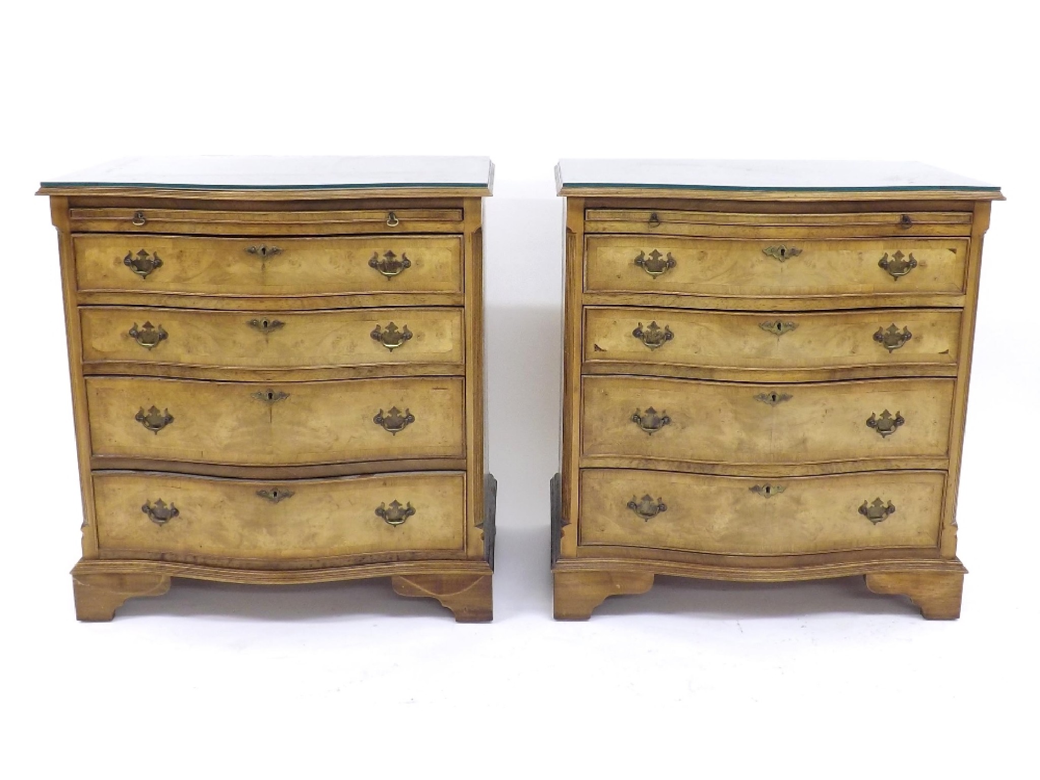 Appraisal: Pair of Georgian style burr walnut veneered serpentine chest of