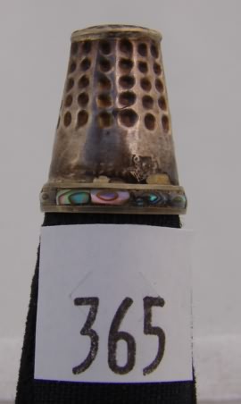 Appraisal: Mexico silver tone thimble with circular decorations inlay on rim