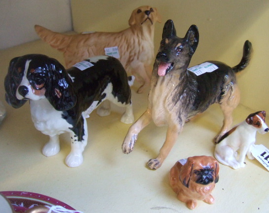 Appraisal: Four Royal Doulton dogs Alsatian retriever Terrier and Pekinese and