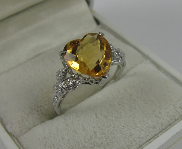 Appraisal: CITRINE DIAMOND AND K WHITE GOLD RING centering a heart-cut