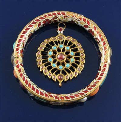 Appraisal: An Indian gold openwork pendant set with turquoise and pink