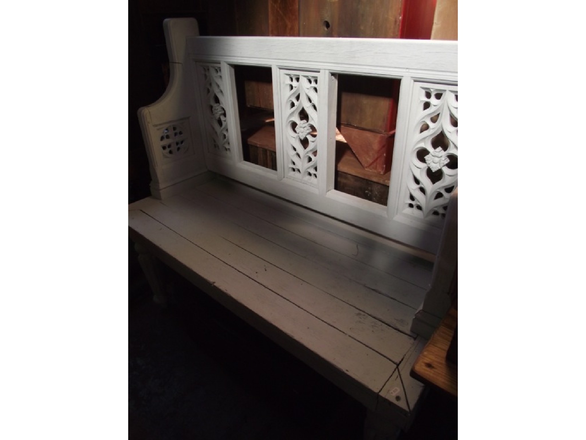 Appraisal: A bench settle the raised back with pierced and carved