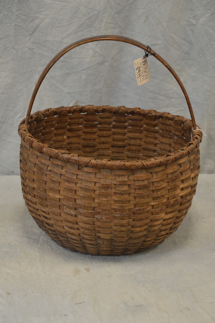 Appraisal: Woven splint gathering basket with bent oak handle probably Pennsylvania