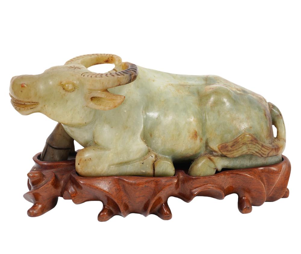 Appraisal: CHINESE JADE FIGURE OF RECLINING OX ON WOOD BASEChinese jade