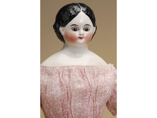 Appraisal: China Lady with Glass Eyes with Wardrobe Germany ca glazed