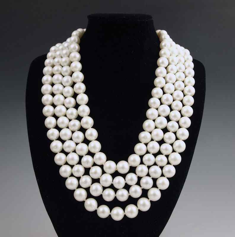 Appraisal: A FOUR STRAND PEARL NECKLACE WITH PLATINUM DIAMOND CLASP A