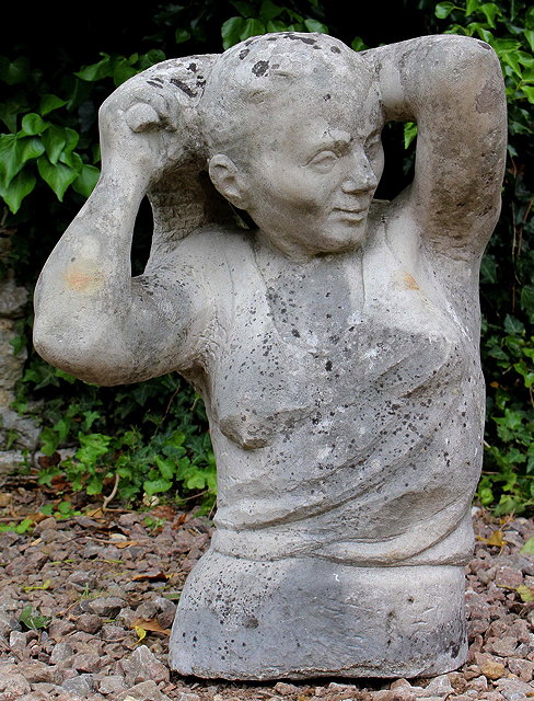 Appraisal: A DECORATIVE BUST OF A YOUNG GIRL styling her hair