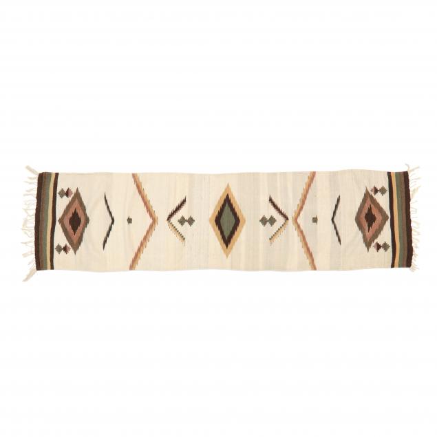 Appraisal: NAVAJO RUNNER Wool ivory ground with mutlicolor diamond shaped medallions