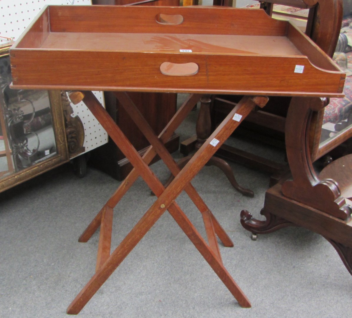 Appraisal: A th century rectangular mahogany butler's tray with pierced handle