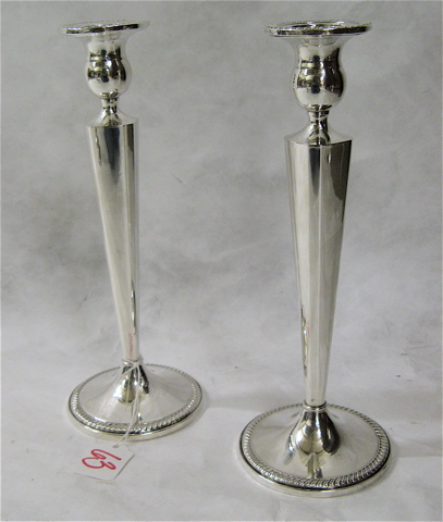 Appraisal: PAIR AMERICAN STERLING SILVER CANDLESTICKS with round bases Marked Weighted