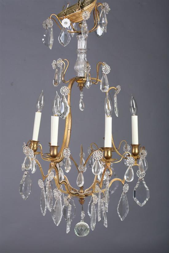 Appraisal: CONTINENTAL CRYSTAL AND GILT-METAL SIX-LIGHT CHANDELIER Early th century Gilt-metal