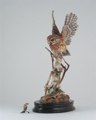 Appraisal: A Hereford bone china model of an owl in flight