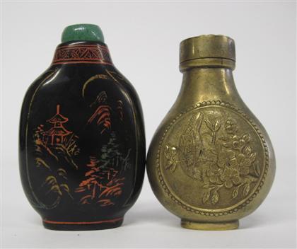 Appraisal: Two Chinese snuff bottles Comprising a gilt metal bottle the