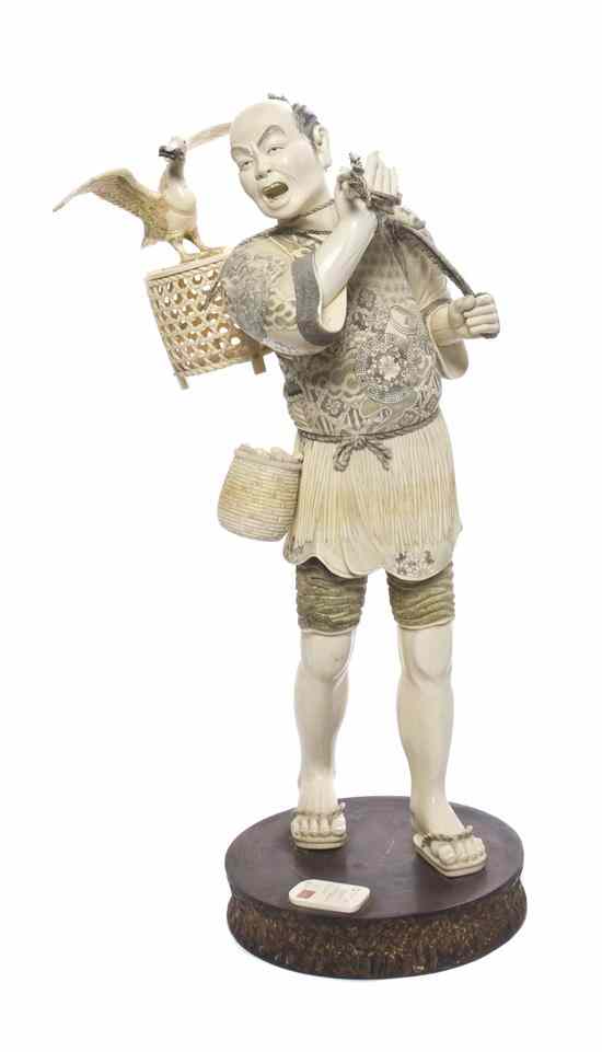 Appraisal: A Japanese Ivory Okimono signed Mitsuhiro depicting a fisherman with