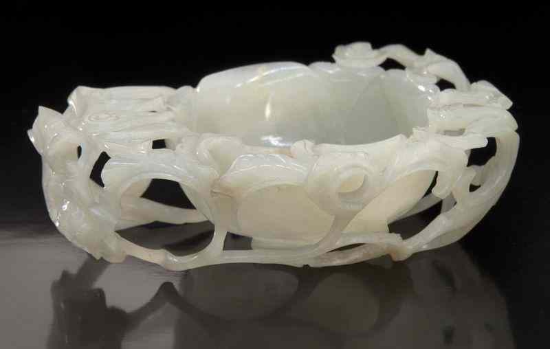 Appraisal: Chinese Ming carved white jade libation cupdepicting scrolling lotus and