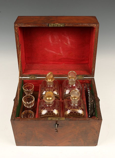 Appraisal: A SET OF FOUR FRENCH GLASS DECANTERS in a mahogany