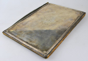 Appraisal: A silk and leather correspondence cover with engraved silver front