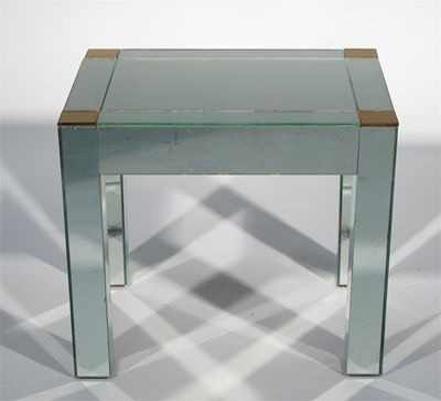 Appraisal: An Art Deco style mirrored glass side table rectangular section