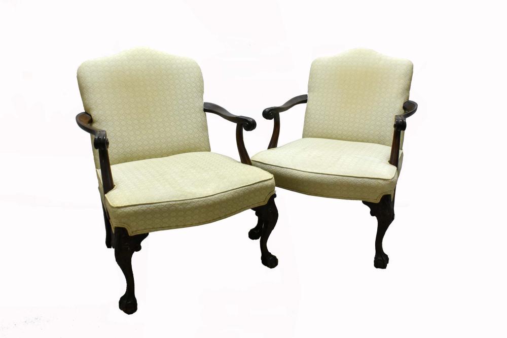 Appraisal: PAIR OF GEORGE III STYLE MAHOGANY LIBRARY ARMCHAIRSThe upholstered backs