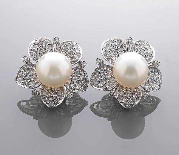 Appraisal: A pair of South Sea cultured pearl and diamond clip-earrings