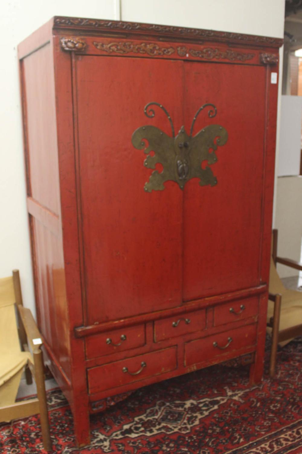 Appraisal: CHINESE MING-STYLE CLOTHING CABINET red lacquer finish engraved brass butterfly