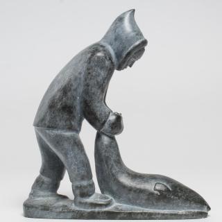 Appraisal: Inuit Eskimo Soapstone Carving Vintage s depicting a man dragging