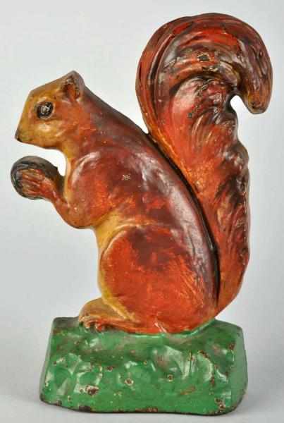 Appraisal: Cast Iron Squirrel with Nut Doorstop Description Marked Blodgett Studio