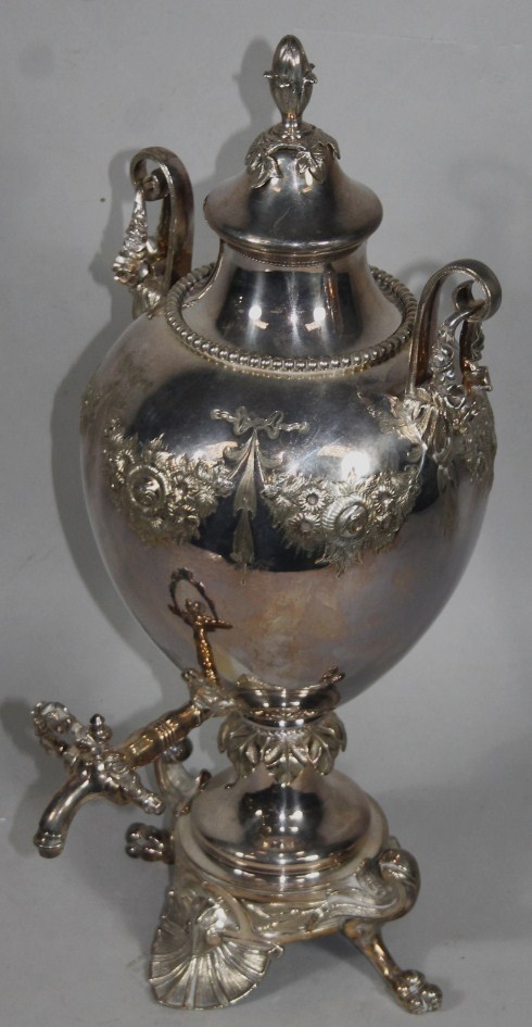 Appraisal: A thC cased silver plated samovar tea urn the bulbous