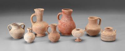 Appraisal: Eight ancient terracotta vessels one with two handles and bands