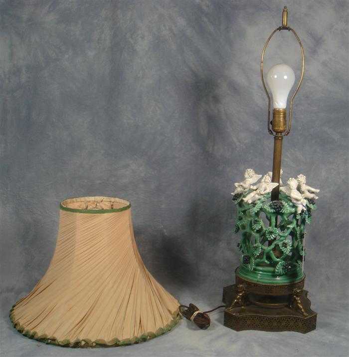 Appraisal: Cherub and grapevine porcelain table lamp mounted on a brass