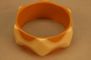 Appraisal: Orange White Vintage Bakelite Bangle with reticulated exterior