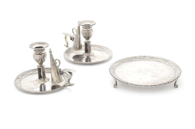 Appraisal: A pair of George III silver chamber-sticks with matching waiter