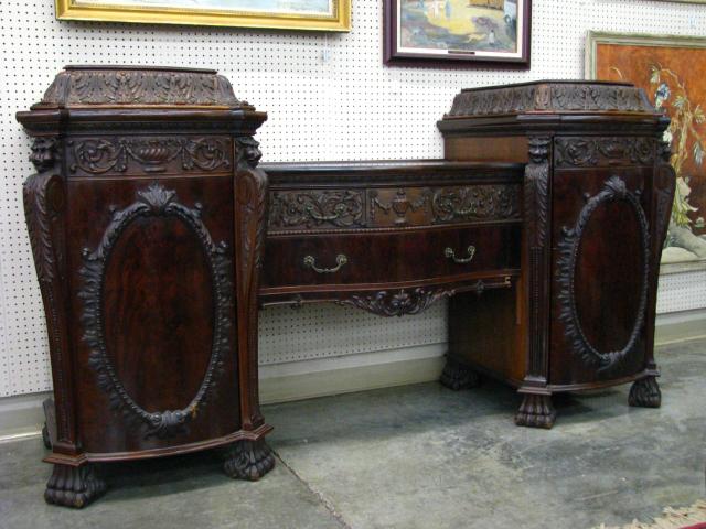 Appraisal: Ornate English Serpentine Mahogany Sideboard with claw feet carved Griffin