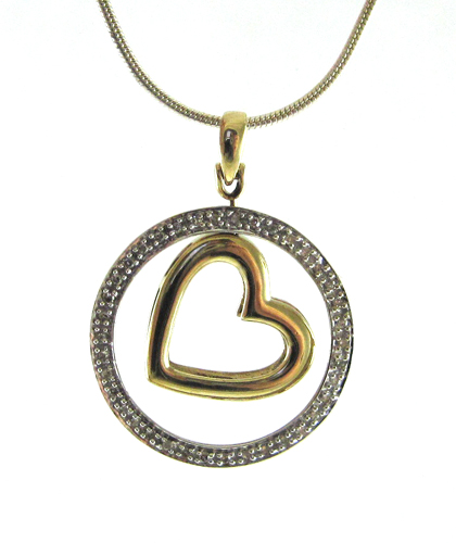 Appraisal: DIAMOND AND GOLD PENDANT WITH STERLING SILVER CHAIN Suspended on