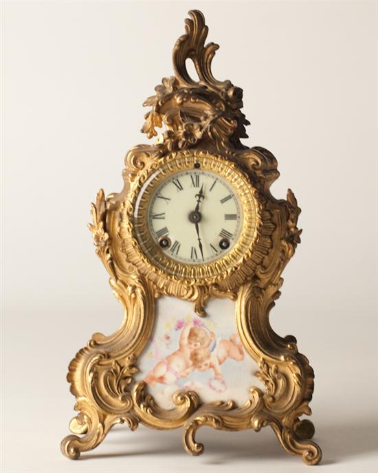 Appraisal: Ansonia Brass Porcelain Shelf Clock porcelain insert of cherub figures