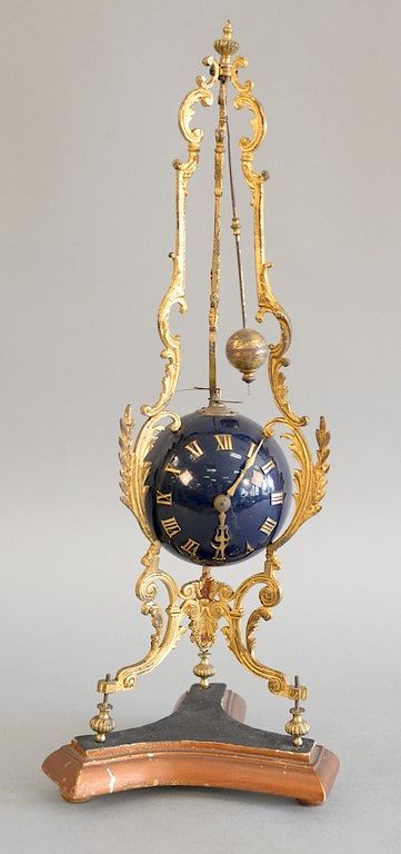 Appraisal: Continental ormolu and blue globular table clock on foliate cast