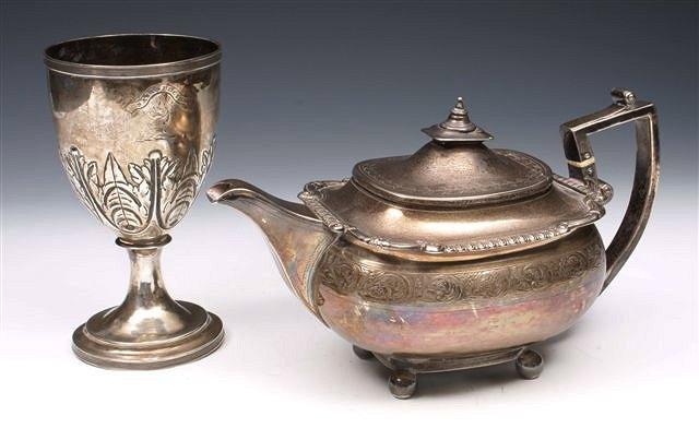 Appraisal: A GEORGE III SILVER TEAPOT oval body with engraved scroll