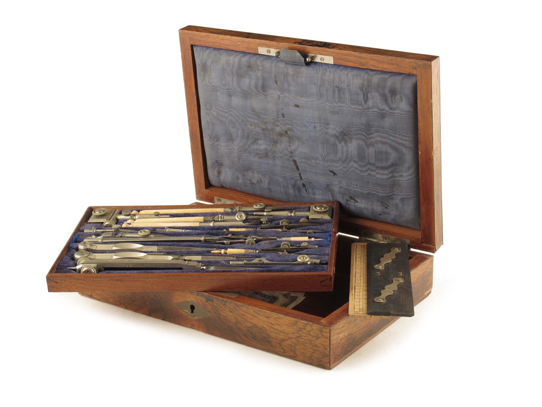 Appraisal: A rosewood and brass inlaid cased set of drawing instruments