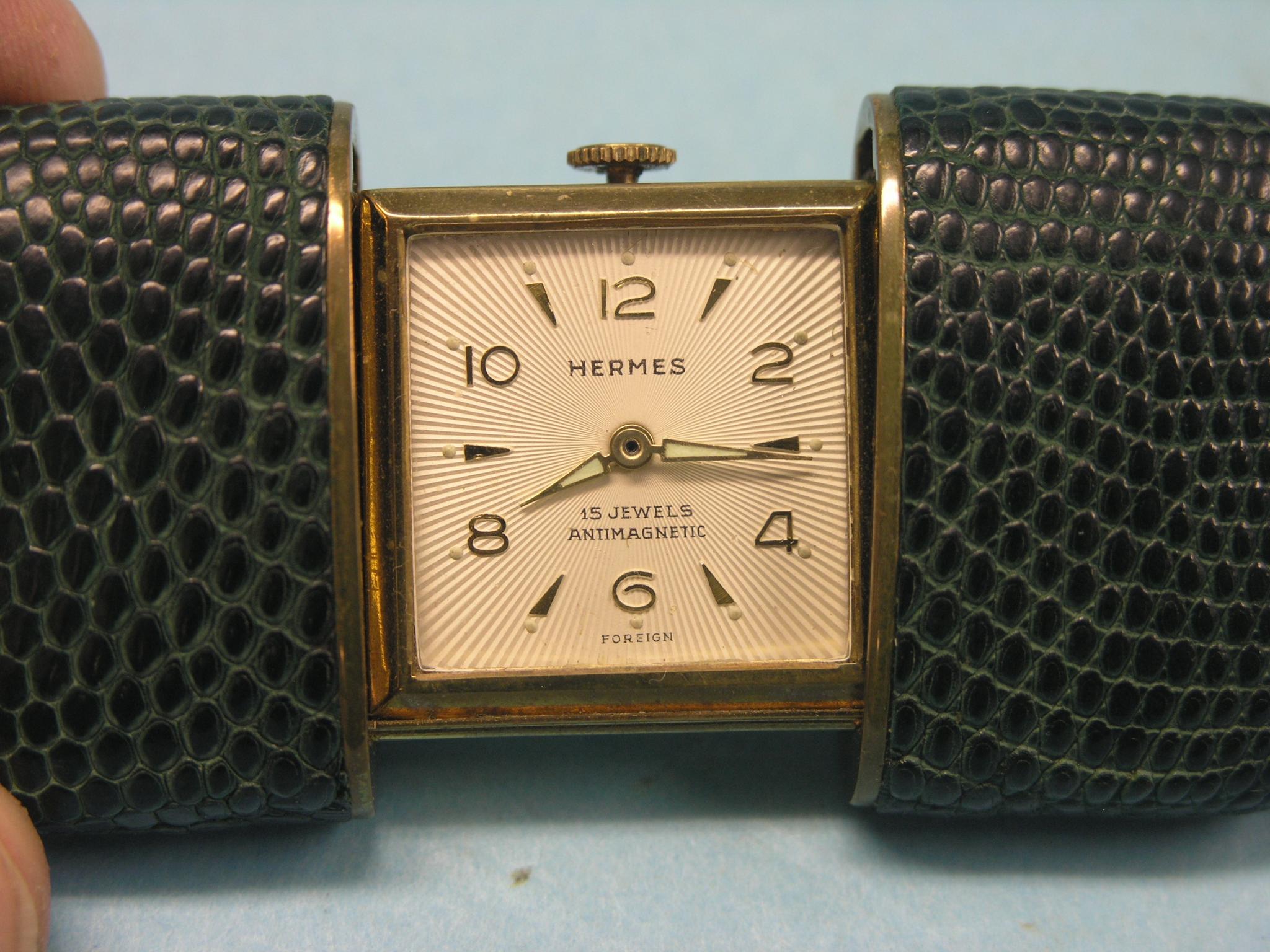 Appraisal: An Hermes travelling watch within folding shark-skin effect case