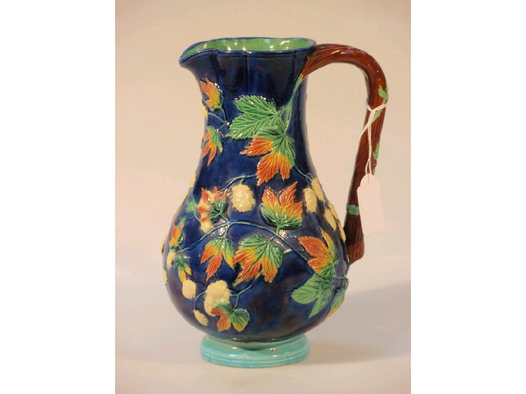 Appraisal: A Victorian majolica jug with a blue orange peel ground