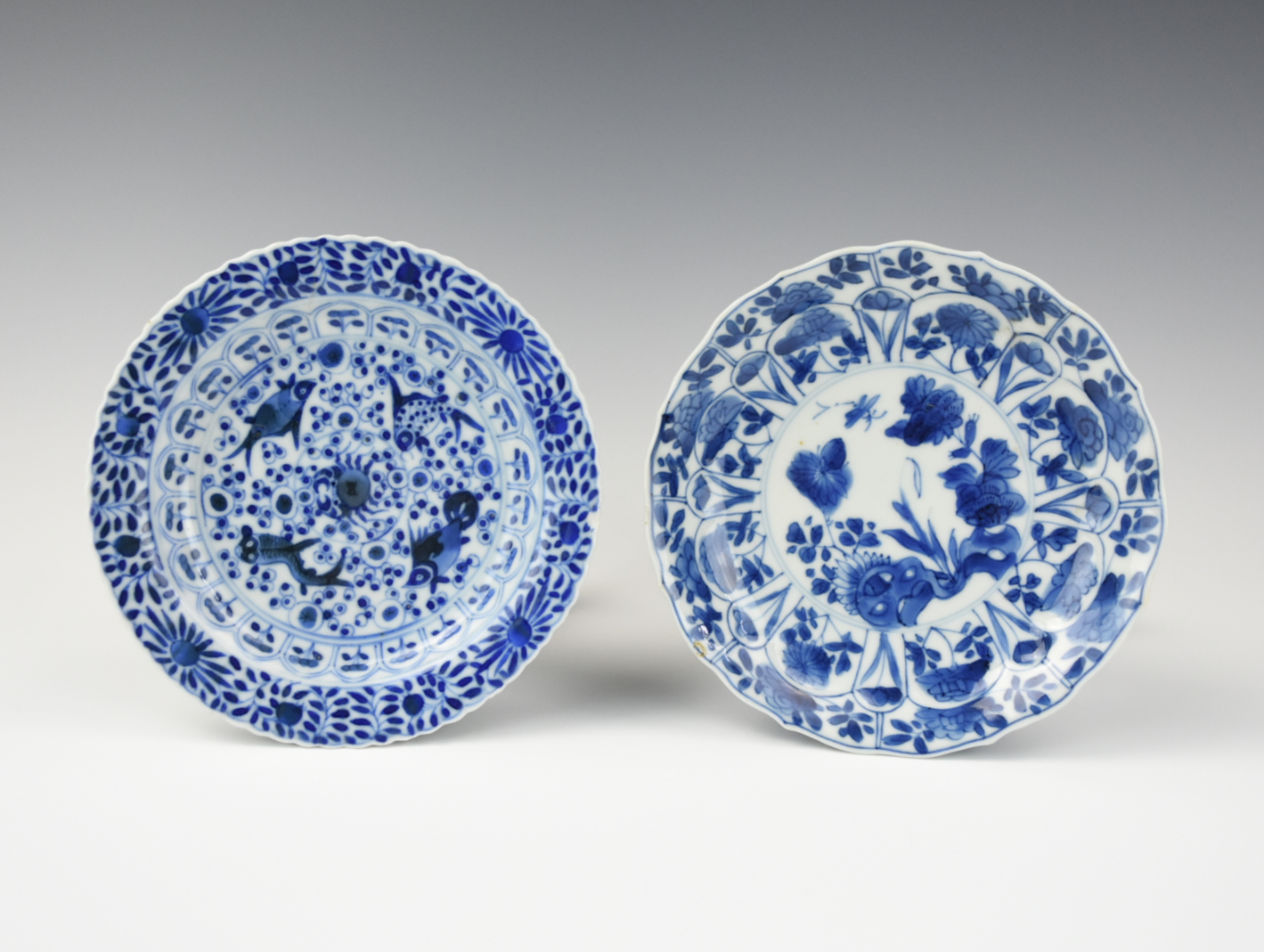 Appraisal: TWO SMALL B W SAUCER DISHES KANGXI PERIOD Chinese Kangxi